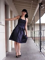 Seductive transsexual Bailey Jay stripping in a motel